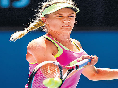 poised to strike Canada's Eugenie Bouchard whips a  forehand during her win over Irina Begu on Sunday. AP Photo.