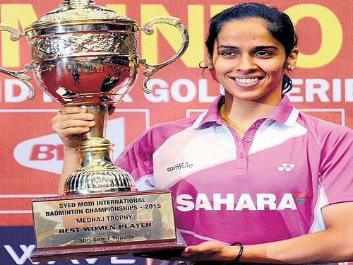 first title of the year Saina Nehwal is all smiles after  retaining the Syed Modi badminton championships in  Lucknow on Sunday. Saina beat Carolina Marin in the final. PTI