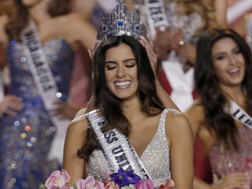 Miss Colombia Paulina Vega smiles as the the crown is placed on her head as she becomes Miss Universe during the Miss Universe pageant in Miami, Sunday, Jan. 25, 2015. AP Photo