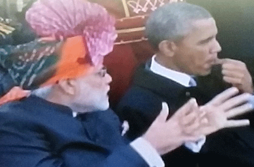 Prime Minister Narendra Modi and US President Barack Obama were greeted with loud cheers as they arrived at Rajpath for the Republic Day parade Monday. Screen grab