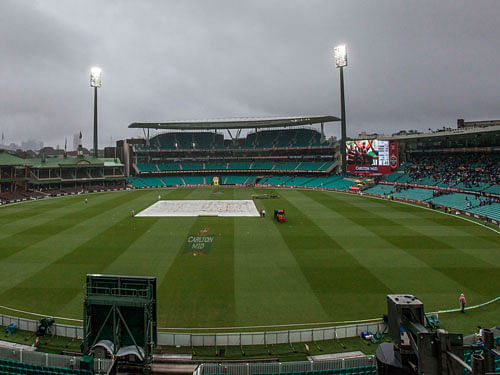 Rain played spoilsport as the tri-series cricket match between India and Australia was today abandoned with the two teams sharing the points, which left the visiting side in with a chance to make it to the final. AP File Photo.