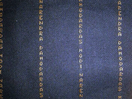 A closeup of the pattern of the suit worn by Prime Minister yesterday spelt out his name Narendra Damodardas Modi. PTI Photo