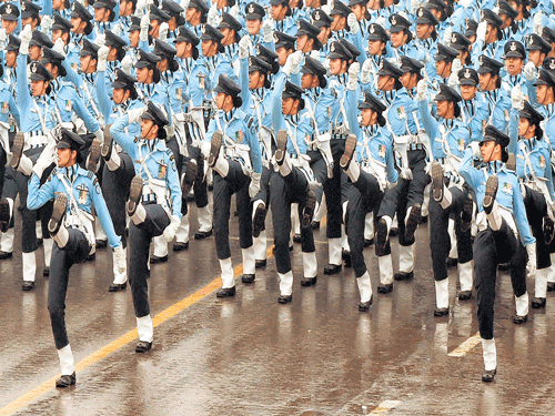 republic salute:  Indian Air Force's all-women contingent marching during the 66th Republic Day Parade at Rajpath in New Delhi on Monday. pti