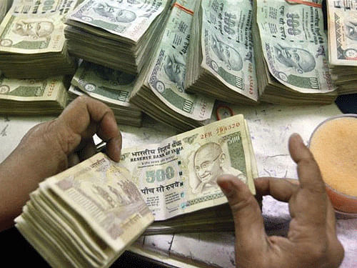 The rupee were quoting at 61.42 against the US currency in late morning deals today amid volatile trading on the back of higher dollar overseas. PTI file photo
