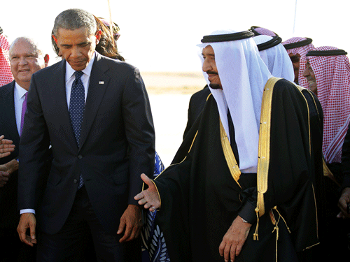 U.S. President Barack Obama walks with Saudi Arabia's King Salman (R) as he arrives at King Khalid International Airport in Riyadh. Reuters File Photo.