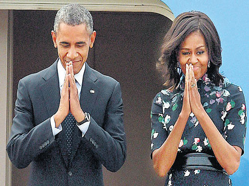 goodbye: US President Barack Obama and first lady Michelle Obama before their departure from Air Force Station Palam in New Delhi on Tuesday. PTI