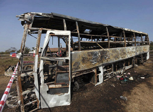A major tragedy was averted late Tuesday night by an alert motorist on national highway 5. About 35 passengers aboard a Hyderabad-bound bus had a close shave after the engine of the bus they were travelling caught fire. File photo PTI