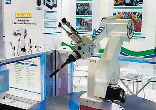 In a bid to end dependence on foreign robots, TAL Manufacturing Solutions, a 100 per cent subsidiary of auto major Tata Motors, is all set to launch its domestically developed robots for the Indian market, a top executive said. One of TAL's robots on display at IMTEX-2015. The robots are available in 0.5-10 kg configurations. DH&#8200;photo