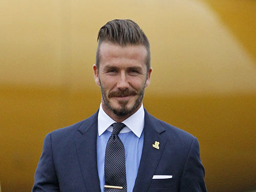 Former footballer David Beckham says he has become a taxi driver for his four children after retirement.  AP File Photo.