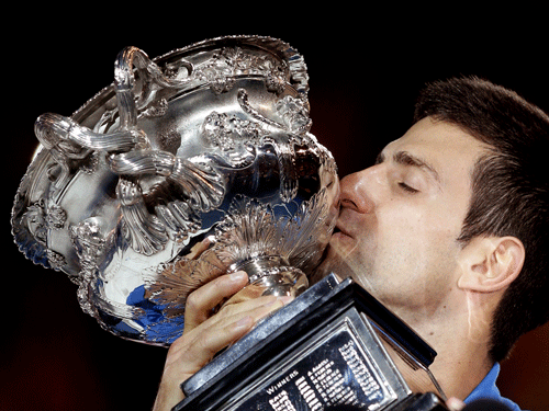 Novak Djokovic reasserted his rule over the hard-courts of Melbourne Park on Sunday, grinding down Andy Murray 7-6(5) 6-7(4) 6-3 6-0 to win his fifth Australian Open title.