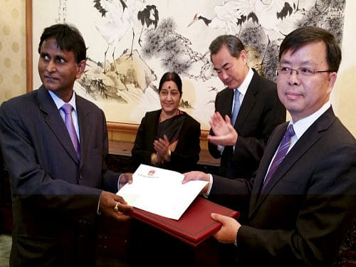 External Affairs Minister Sushma Swaraj with Wang Yi, Foreign Minister of People's Republic of China witnessing officials of India-China exchange notes on additional route for Kailash Manasarvor Yatra, in Beijing. India and China are exploring the possibility of a visit by Prime Minister Narendra Modi's to Kailash-Manasarovar when he travels to China in May. PTI