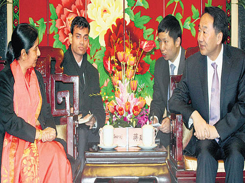Sushma Swaraj with Jiang Jiangao, Director of State Council of  Information in Beijing on Sunday.  PTI