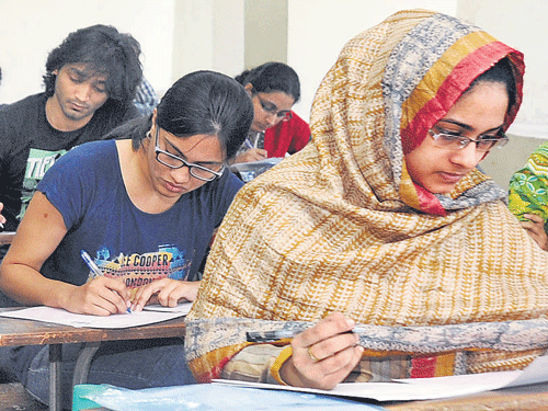 Students write the ComedK Post Graduate Entrance Test (PGET) for medical and dental courses in Bengaluru on Sunday. dh photo