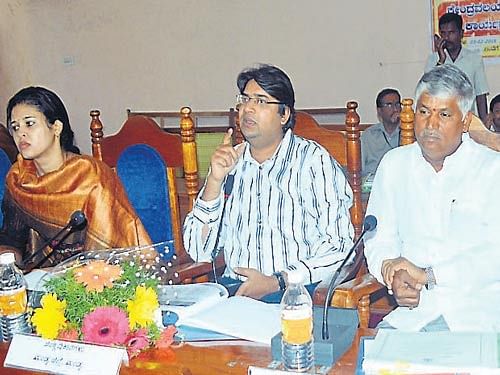 MP C S Puttaraju, ZP CEO Rohini Sindhuri, DC Ajai Nagabushan and others at the progress review meeting, in Mandya, on Tuesday. DH photo