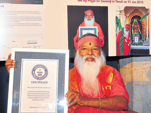 Avadhootha Datta&#8200;Peetha seer Sri Ganapathy Sachchidananda displays 'Guinness Book of World Records' citation at his ashram, in Mysuru, on Wednesday. DH&#8200;photo
