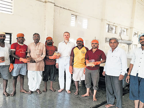 Alexander Usanin, the trader from Moscow, with producers of organic jaggery at the jaggery park at Mudhol in Bagalkot district. dh photo