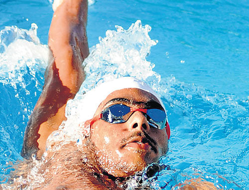 top notch: Karnataka's Arvind M&#8200;put up a career-best show en route his silver in 100M  backstroke at the National Games in Thiruvananthapuram. file photo