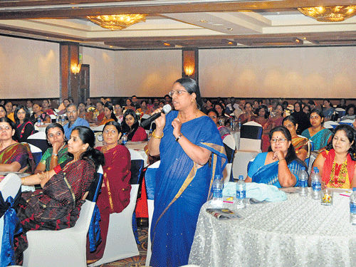 tell me how: N Padmini, Principal, MTB Jnana Jyothi Vidyanikethan, Mahadevapura, asks a question at a seminar on child safety organised by Deccan Herald Newspaper in Education (DHiE) in association with Allen Career Institute in the City on Friday. DH photo