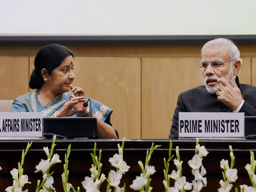 Prime Minister Narendra Modi and External Affairs Minister Sushma Swaraj at the conference of Heads of Missions on 'Diplomacy for Development : New vision, New vigour', in New Delhi on Saturday. PTI Photo