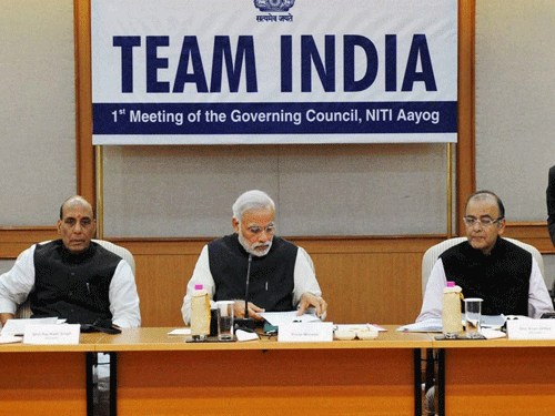 Prime Minister Narendra Modi along with Union Ministers chairing the first meeting of Governing Council of NITI Aayog in New Delhi on Sunday. PTI Photo