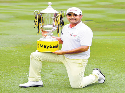 CHAMPION Anirban Lahiri&#8200;poses with the trophy after winning the Malaysian Open in Kuala Lumpur on&#8200;Sunday. AFP