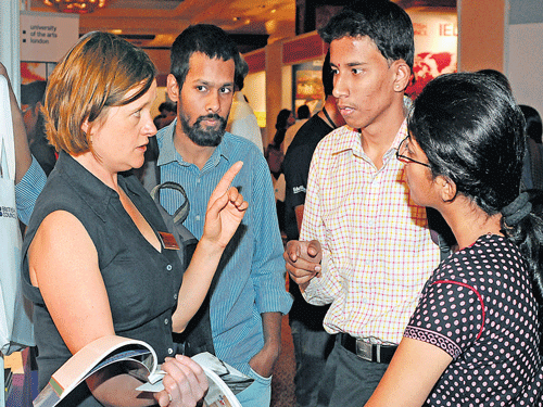 Visitors at the UK education exhibition organised by British Council at a hotel in the City on Monday. DH PHOTO