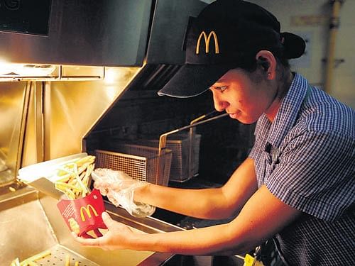 McDonald's Corp is cutting the amount of calories and salt on its Indian menu as it fights to hold on to customers in a rapidly growing developing market where newer, healthier fast food options are just starting to catch on.