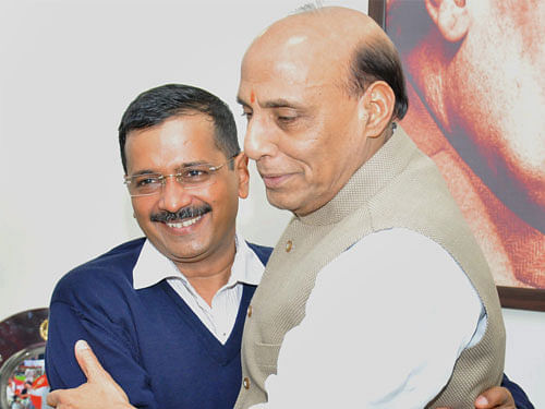 Union Home Minister Rajnath Singh and Delhi Chief Minister- designate Arvind Kejriwal at a meeting at the former's residence in New Delhi on Wednesday. PTI Photo