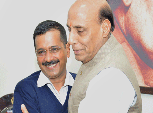 Union Home Minister Rajnath Singh and Delhi Chief Minister- designate Arvind Kejriwal at a meeting at the former's residence in New Delhi on Wednesday. PTI Photo