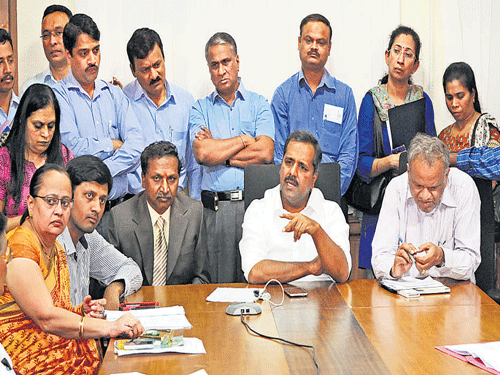 Health and Family Welfare Minister U T Khader speaks to  officials through video conferencing during a meeting on precautionary measures to prevent swine flu, in Bengaluru on Thursday. DH photo