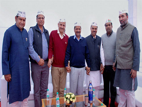 The newly elected ministers of Arvind Kejriwal's cabinet were today treated to home-cooked lunch by the chief minister himself at his office at Delhi Secretariat. PTI Photo.