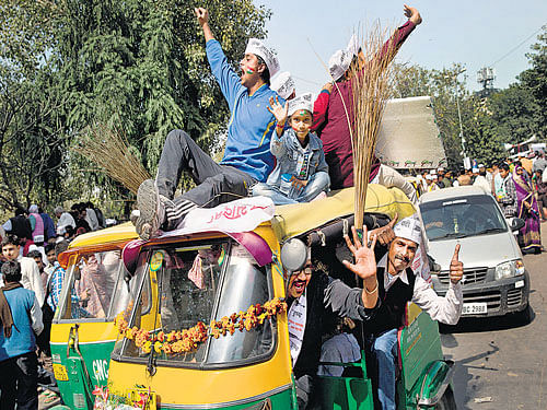 AAP supporters shout slogans outside Ramlila Maidan in Delhi on Saturday. AP Photo