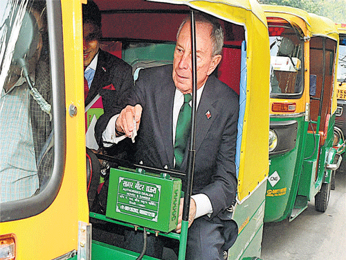United Nations Special Envoy for Cities and Climate Change Michael R Bloomberg arrives in an autorickshaw for the Re-Invest meet in New Delhi on Monday. PTI Photo
