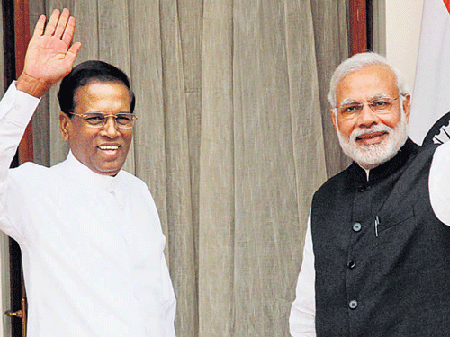Prime Minister Narendra Modi with Sri Lankan President Maithripala Sirisena in New Delhi on Monday. DH photo