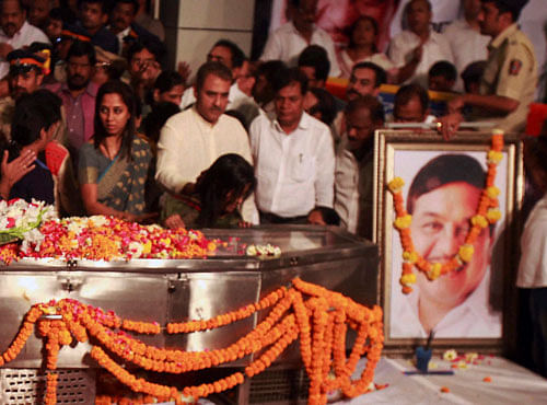 NCP leaders Praful Patel, Supriya Sule and others pay homage to party leader RR Patil at party office, who died at Lilavati hospital in Mumbai on Monday. PTI Photo