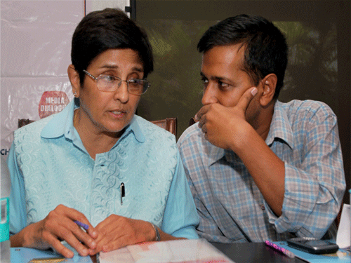Arvind Kejriwal and Kiran Bedi may have fought a bitter electoral battle but the two leaders exchanged pleasantries.PTI File Photo