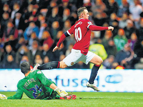 red alert Manchester United's Wayne Rooney (right) takes a tumble leading to a penalty kick during their FA&#8200;Cup fifth round clash against Preston North End. reuters