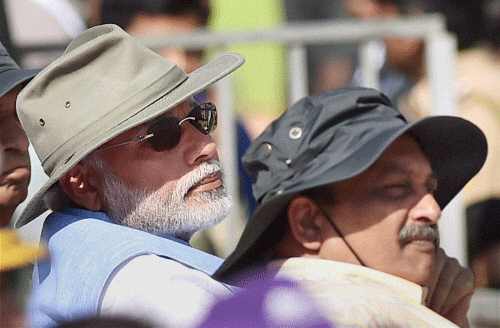 Prime Minister Narendra Modi and Defence Minister Manohar Parrikar during the inauguration of the Aero India 2015, Asia's Premier Air Show at Yelhanka Air Base in Bengaluru on Wednesday. PTI Photo