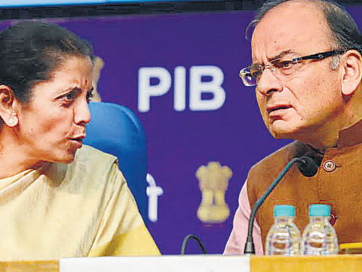 Finance Minister Arun Jaitley and Commerce and Industry Minister Nirmala Sitharaman interacts during the inaugural function of the eBiz portal in New Delhi on Thursday.