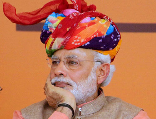 It's out with the flashy suit, in with religious tolerance for Prime Minister Narendra Modi, who is seeking to soften his image after an electoral pounding in New Delhi and grumblings in his party about his top-down leadership style.  PTI photo