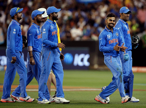 India's Virat Kohli celebrates with teammates after they won their Cricket World Cup match against South Africa at the Melbourne Cricket Ground (MCG) February 22, 2015. REUTERS photo