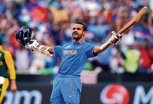 Shikhar Dhawan exults after scoring a ton against South Africa in Melbourne on Sunday. AP