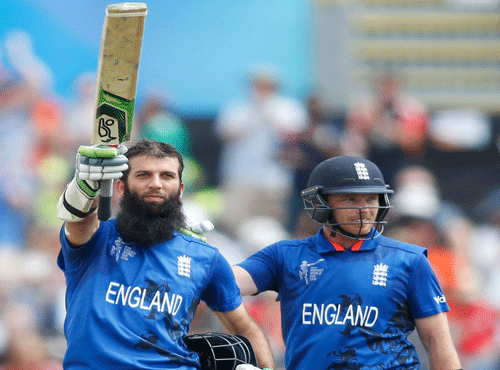 England batsman Ali celebrates 100 runs as he is congratulated by Bell during their Cricket World Cup match against Scotland in Christchurch. Reuters photo