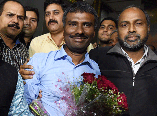 Priest, Father Alexis Prem Kumar, abducted in Afghanistan eight months back, on his arrival at New Delhi's airport. PTI photo