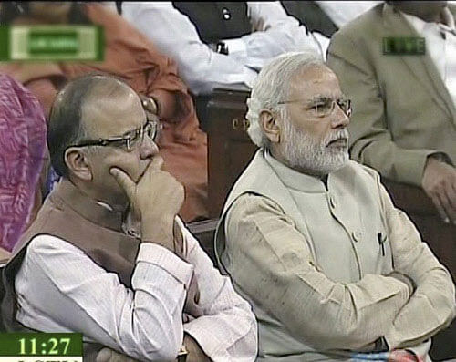 Prime Minister Narendra Modi with Finance Minister Arun Jaitley during President's address to Joint Session of both Houses of Parliament during the Budget session in New Delhi on Monday. PTI Photo