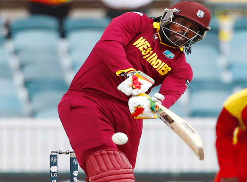 West Indies batsman Gayle plays a shot to the boundary for four runs during their World Cup Cricket match against Zimbabwe in Canberra. Reuters photo