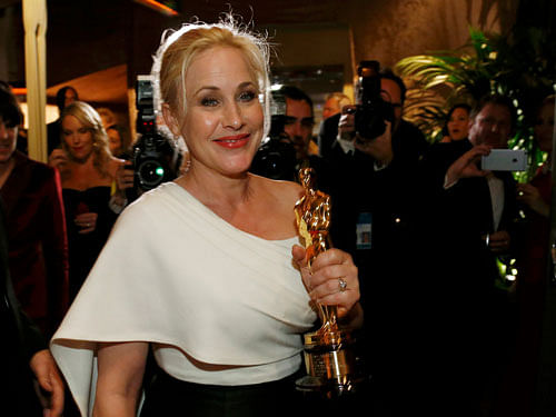 Patricia Arquette holds her Oscar for best supporting actress for her role in 'Boyhood' at the Governors Ball following the 87th Academy Awards in Hollywood. Reuters Photo