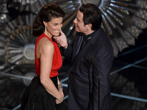 Idina Menzel, left, and John Travolta present the award for best original song at the Oscars on Sunday, Feb. 22, 2015, at the Dolby Theatre in Los Angeles.AP Photo
