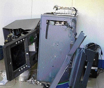 Junked A Corporation Bank ATM kiosk near R L Jalappa Camp in Doddaballapur,  damaged by thieves in their bid to steal cash on Tuesday. DH PHOTO