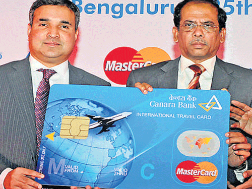 MasterCard Division President (South Asia) Ari Sarker (left) with Canara Bank MD and CEO V S Krishna Kumar. DH PHOTO by S K Dinesh